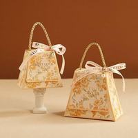 Boîte à dragées en papier en forme de sac, décorée de fleurs, avec poignée en corde et ruban