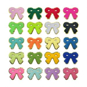 NODA Stock Patchs thermocollants/auto-adhésifs brodés en chenille colorée en forme de nœud - Product Image 1