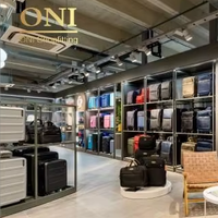 Meubles de magasinage pour bagages personnalisés, unité d'affichage de sacs murale sur mesure, vitrine