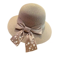 Vente en gros de chapeaux de soleil d'été pour femmes chapeau de paille de plage à large bord avec nœud décoratif en perles pour la pêche et les activités de plein air