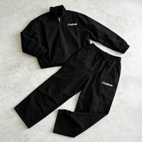 Ensemble 2 pièces Y2K Streetwear pour homme : Pull léger en nylon à demi-zip avec poignets élastiques et pantalon ample à cordon de serrage imprimé