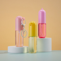 Flacon pulvérisateur de parfum de poche rond en plastique de 20 ml avec logo personnalisé, idéal pour les voyages, avec pompe à brume et porte-clés