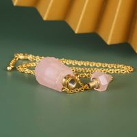 Bouteille de parfum d'huile essentielle collier de pendentif de bijoux de quartz rose de pierre de cristal rose naturel