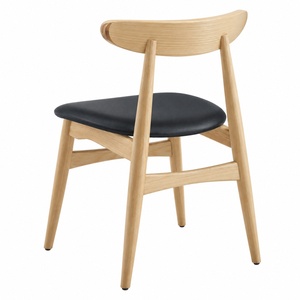 Chaise de salle à manger scandinave moderne en bois massif avec coussin en cuir PU noir et dossier incurvé pour restaurant USA DDP - Product Image 5