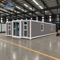 Conteneur de stockage modulaire préfabriqué de luxe moderne de 40 pieds en panneaux sandwich d'acier extensibles à double aile de qualité supérieure pour