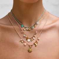 Collier J&D Summer Jewelry en acier inoxydable avec pendentifs en forme de lune, d'étoile, de soleil, de fleurs bleues, roses, oranges, blanches, de cœur, de perle, de papillon, de corde