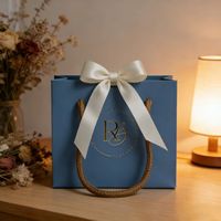 Sac cadeau en coton recyclable de luxe avec nœud en ruban, estampage à chaud doré, logo personnalisé pour colliers, bijoux et bracelets – Vente en gros