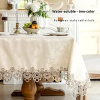 Nappe rectangulaire pour six personnes en fibre chimique soluble dans l'eau, motif floral et bordure en dentelle