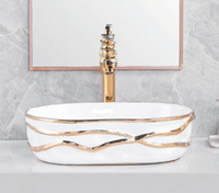 Lavabo de salle de bain en céramique de luxe de forme ovale, design artisanal, finition électrolytique multicolore, lavabo de table