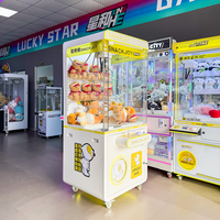 Vente en gros usine Naughty Dog Borne d'arcade grue à pinces en métal pour enfants, éclairage dégradé coloré personnalisé, cadeau porte-bonheur 2 en 1