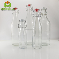 Bouteilles en verre rondes personnalisées par le fabricant, 250 ml, 500 ml, 750 ml, 1000 ml, avec bouchon à clip pivotant pour l'eau, les jus, les boissons, l'huile, les spiritueux