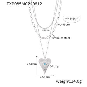 Collana pendente malocchio a forma di cuore placcato in PVD oro 18K | Catena a strati in acciaio inossidabile con simbolo protettivo - Product Image 6