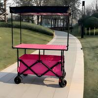 Chariot de camping pliable à quatre roues, imperméable, avec pare-soleil mobile et grande planche de travail