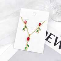 Ensembles de bijoux en cuivre plaqué or 18 carats avec pendentif feuille en zircone bleu ciel et boucles d'oreilles pendantes, vente en gros