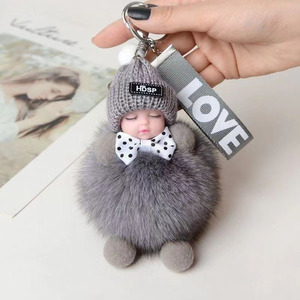 พวงกุญแจตุ๊กตาขนฟูนุ่มรูปเด็กน้อย พร้อมโบว์ผูก  ลดราคาสุดฮอต - Product Image 4