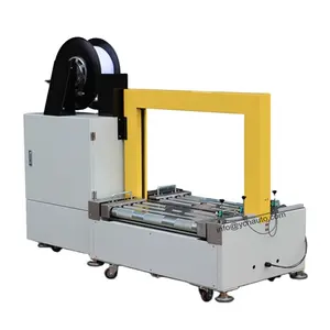 Fully Automatic PP Straps Feeding Low Desk Carton Strapping Conveyor Machine With Conveyor For Sale
