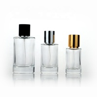 Venta al por mayor 30ml 50ml 100mL botella de perfume de vidrio transparente redonda con tapa plateada