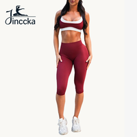 Ensemble de yoga color block à faible MOQ, soutien-gorge de sport à double bretelle fine et leggings taille haute longueur genou, ensemble de sport 2 pièces