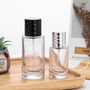 Botellas de perfume cilíndricas de hombro plano al por mayor en stock de fábrica, botellas de spray cosmético de vidrio transparente vacías para envasado. - Product Image 1