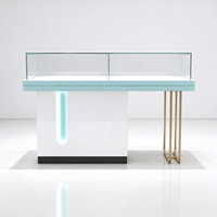 Vitrines optiques en verre blanc avec comptoir d'exposition, barre lumineuse, pieds en tube doré, protection en verre, CE ETL pour magasin d'optique