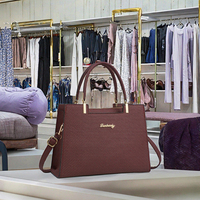 2025 nouvelle mode dames Litchi motif décontracté fourre-tout sac à main simple épaule fermeture éclair chaînes PU 20L lavage à la main en gros d'âge moyen