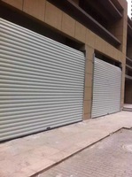 Porte à enroulement en aluminium insonorisante avec un design minimaliste pour les supermarchés, réduction efficace du bruit