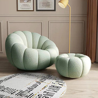 Fauteuil lounge pivotant en forme de citrouille blanc crème avec repose-pieds