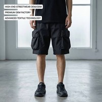 Shorts cargo utilitaires personnalisés en nylon mélangé, résistants à l'eau, avec plusieurs poches 3D, cordon de serrage et teinture unie, pour un style urbain.