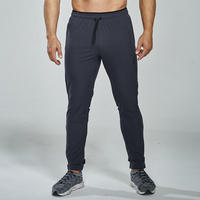 Pantalon de jogging élastique pour homme, motif uni, avec fermeture éclair, idéal pour le sport, la course, le football et l'entraînement en automne