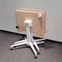 Bureau ergonomique en fer avec réglage pneumatique de la hauteur, roulettes mobiles, plateau rabattable à 90°, design moderne et compact, idéal pour usage commercial