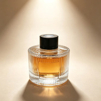 Nouvelle bouteille de parfum en verre ronde unique de 100 ml, diffuseur d'arômes cylindrique en verre avec logo personnalisé