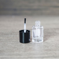Bouteille d'huile pour cuticules de forme ronde transparente personnalisée de 15ml bouteille vide de vernis à ongles pour huile pour cuticules avec capuchon noir et brosse