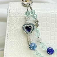 Nueva funda para teléfono con correa de pulsera de lentejuelas metálicas con efecto de diamante y cadena colgante