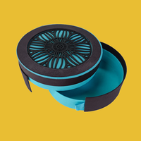 STPP a développé une boîte d'emballage ronde pour chocolats de luxe avec impression personnalisée de forme unique, pour emballer des chocolats en cadeau avec une forme ronde
