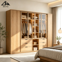 Armoire de chambre en bois avec portes vitrées, éclairage LED, tiroirs, tringle de suspension et grand espace de rangement pour la maison et les projets hôteliers
