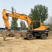 Excavatrice sur pneus Hyundai 210 d'occasion, modèle 2024, très populaire et très demandée, avec moteur Cummins, pompe hydraulique Kawasaki, moteur, engrenage et contrôle PLC