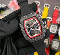 Montre mécanique squelette tendance pour homme avec boîtier tonneau, mouvement visible et bracelet textile orange