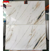 Grande dalle de marbre Calacatta blanc à veines dorées, polie, design moderne, qualité supérieure, pour hôtels, escaliers, revêtements muraux et comptoirs.