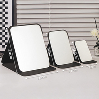 Miroir de maquillage de voyage portable avec logo en relief personnalisé miroir de poche en cuir PU de haute qualité pour femmes boîte unique bas quantité minimale de commande