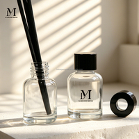Diffuseur de parfum en verre rond transparent de qualité supérieure 30 ml avec bouchon noir et bâtonnets aromatiques Modèle YM
