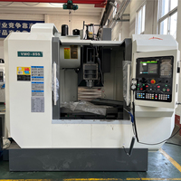 Centre d'usinage vertical CNC 3 axes Tour CNC Fraiseuse Automatique Prix VMC