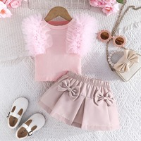 Annshine Wholesale 2026 Ensemble haut à manches en maille couleur unie et jupe à nœud pour filles, best-seller