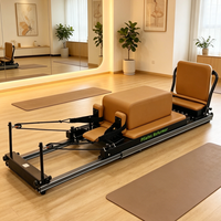 Reformer Pilates pliable pour la maison, avec structure en aluminium et design coulissant, idéal pour le fitness et l'entraînement du tronc