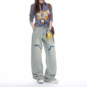 Pantalon droit délavé effet vieilli avec patchs de la marque American Trendy, versions homme et femme en denim bleu clair - Product Image 1