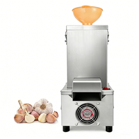 Machine à peler l'ail électrique commerciale 25KG/H Haute efficacité Acier inoxydable Facile à nettoyer pour restaurant et transformation alimentaire