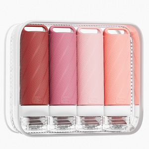 Botellas de viaje portátiles de silicona con lazo para colgar para productos de baño, 50 ml cada una, juego de 4 colores - Product Image 1