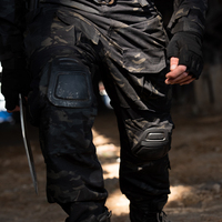 Marchands de vêtements et d'uniformes chinois vendent des uniformes tactiques légers et des pantalons tactiques de chasse de randonnée en plein air