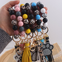 Cadeau pour la fête des mères, porte-clés en silicone à motif léopard avec pompon, breloques mignonnes en forme de patte de chien, bracelet porte-clés, porte-clés de voiture