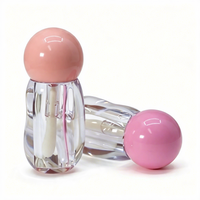 Tube de gloss transparent à effet d'ondulation irrégulière, avec bouchon sphérique, emballage vide pour gloss