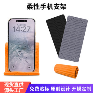 Soporte Flexible de Silicona para Teléfono, Plegable, para Escritorio, en Naranja, Negro y Gris, Universal para Celulares - Product Image 1